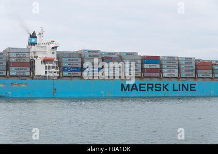 ROTTERDAM, NETHERLANDS - JUNE 28, 2015: Maersk Line container ship leaving the Rotterdam harbor. It is the world's largest conta