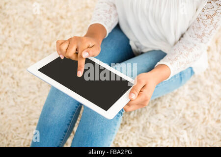 Cropped image of woman using tablet Stock Photo