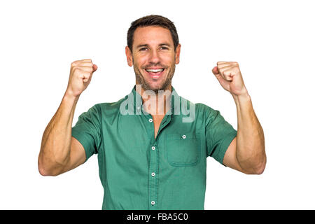 Happy man rejoicing raising fists Stock Photo