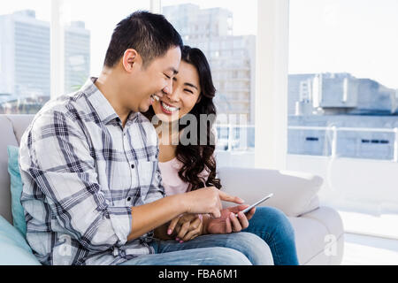 Couple using smart phone Stock Photo