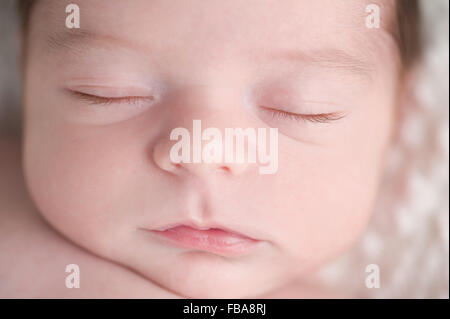 Close-up Shot of a Newborn Baby Boy's Face Stock Photo