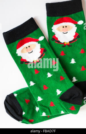 Christmas socks with Father Christmas Santa Claus and Christmas trees on set on white background Stock Photo