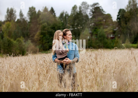 Finland, Uusimaa, Raasepori, Karjaa, Father with his daughter (6-7) looking at view