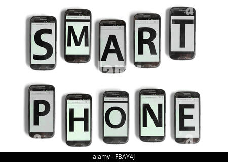 Smart Phone spelled out on mobile phone screens photographed against a white background. Stock Photo