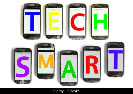 Tech Smart spelled out on mobile phone screens photographed against a white background. Stock Photo