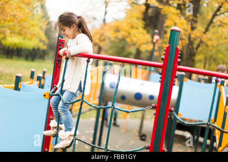 Little girl at playground Stock Photo - Alamy