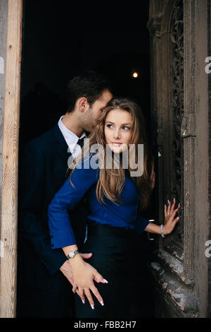 man and woman posing in door Stock Photo