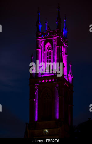 St. Stephen's Church in Bath lit in striking purple at night. A church positioned above the UNESCO World Heritage city of Bath Stock Photo