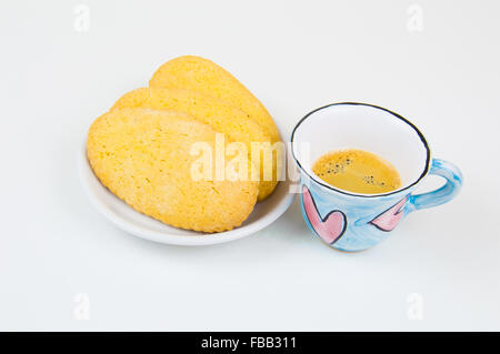 Colorful coffee cup with hand draw of love heart on wood board Stock Photo