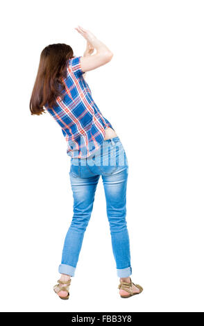 back view of woman protects hands from what is falling from above. Man holding a heavy load Rear view people collection. backside view of person. Isolated over white background. A young girl in a checkered blue with red stripes frightened covers his face Stock Photo