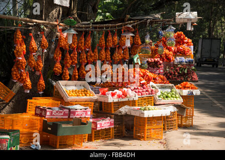 A stall selling imported oranges on sale beside the A1 highway (Colombo-Kandy ) Highway in Sri Lanka. Stock Photo