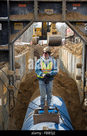 Columbiaville, Michigan USA - 13th January 2016 - Construction of a water pipeline for Flint, Michigan and surrounding areas. The pipeline will take water from Lake Huron through a 70-mile pipeline. Flint's decision to draw its water from the Flint River until construction is complete--instead of continuing to buy it from Detroit--has led to elevated levels of lead in Flint children. Credit:  Jim West/Alamy Live News Stock Photo