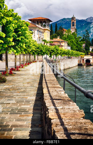 Lakeside Walkway with Mulberry Trees  and a Classic Hotel, Tremezzo, Lake Como, Lombardy, Italy Stock Photo