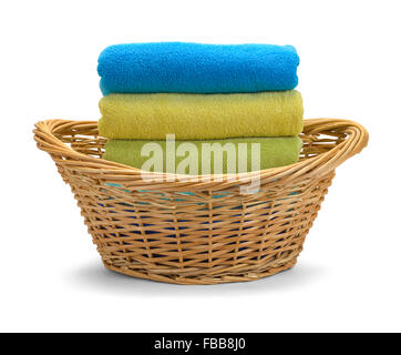 Wicker Basket with Folded Towels Isolated on White Background. Stock Photo