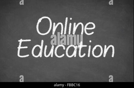 Online education handwritten with white chalk on a blackboard Stock Photo