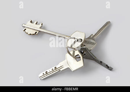 Bunch of keys isolated on grey background Stock Photo