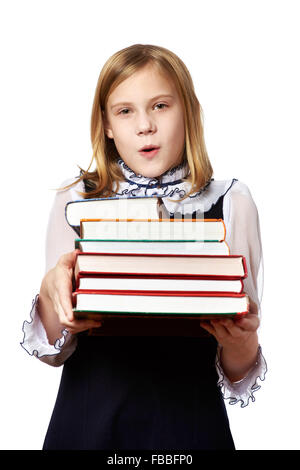Girl schoolgirl with a heavy stack of books isolated Stock Photo - Alamy