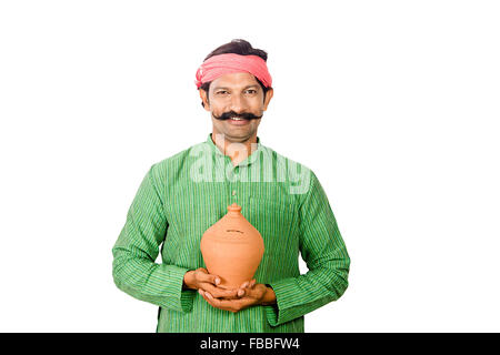 1 indian Rural man Piggy Bank Saving money Stock Photo