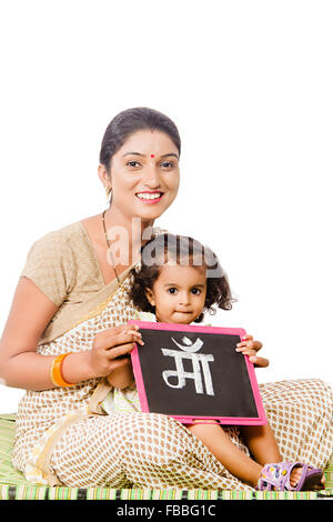 2 indian rural mother and kid daughter slate Board education Stock Photo