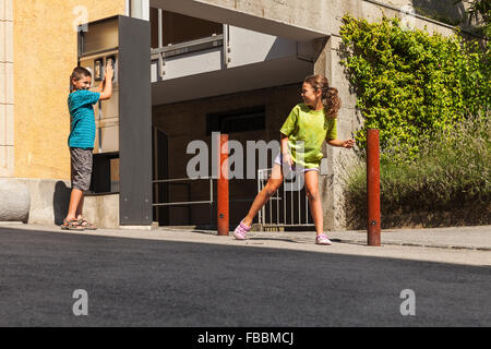 Children ring the bell and run away Stock Photo