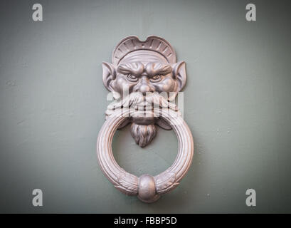 Ornamental handle of an old door in Rome Stock Photo