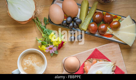 Healthy breakfast sandwich boiled eggs coffee flowers on wooden tablet Stock Photo