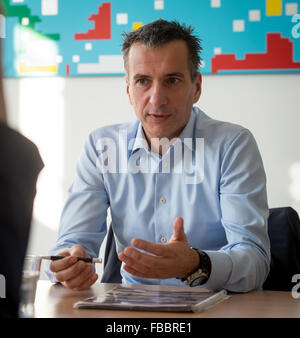 Waldenbuch, Germany. 8th Dec, 2015. Chairman of the management board of chocolate manufacturer Ritter Sport, Andreas Ronken, speaks during an interview in his office at the company headquarter in Waldenbuch, Germany, 8 December 2015. Photo: Daniel Maurer/dpa/Alamy Live News Stock Photo