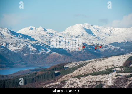 Two sea king helicopters from HMS Gannet in Prestwick flying over Loch Lomond on a winter day Stock Photo