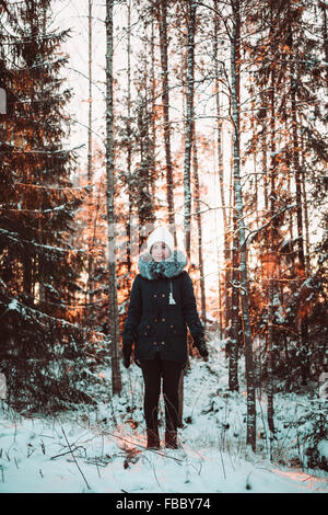 Pretty girl on a winter forest Stock Photo