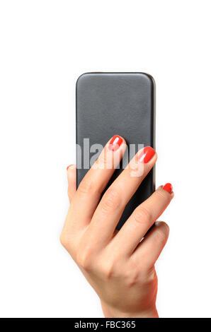 Young woman with red painted fingernails holding a mobile phone in the air with the back towards the camera, close up isolated o Stock Photo