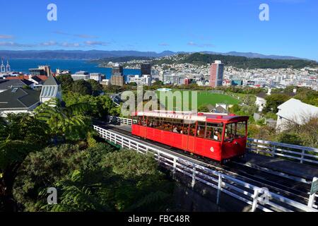 Wellington's historic cable car descending from Kelburn to Lambton Quay in  Wellington's city below and to the harbour beyond,North Island,New Zealand Stock Photo