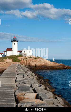 Eastern Point Lighthouse in Gloucester, Massachusetts, offers a nearly one mile view from the jetty on a sunny summer day. Stock Photo