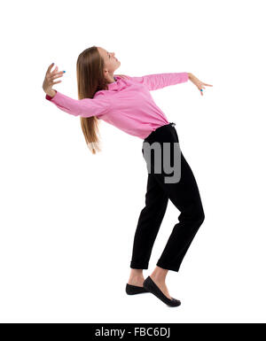 Balancing young business woman. or dodge falling woman. Rear view people collection. backside view of person. Isolated over white background. Woman office worker in a pink shirt leans back heavily. Stock Photo