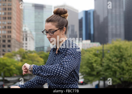 Young professional woman in the city. Photographed in New York City in October 2015. Stock Photo