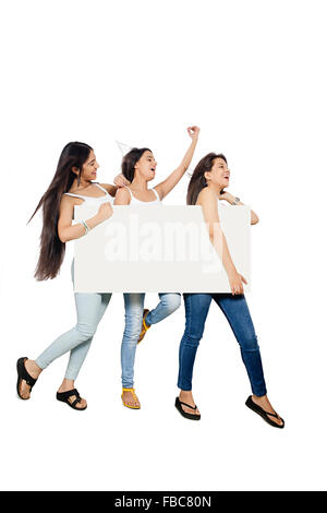 3 indian Beautiful Young Womans  friends showing Message Board Stock Photo