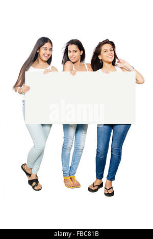 3 indian Beautiful Young Womans  friends showing Message Board Stock Photo