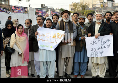 Journalists chant slogans against the attack on private TV Chanel in Islamabad last night during protest demonstration at Peshawar press club on Thursday, January 14, 2016. Stock Photo