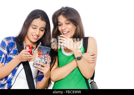 2 indian Young Womans  friends college students Mobile Phone Messaging Stock Photo