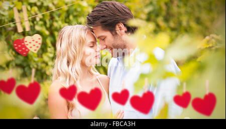 Composite image of young romantic couple embracing each other Stock Photo