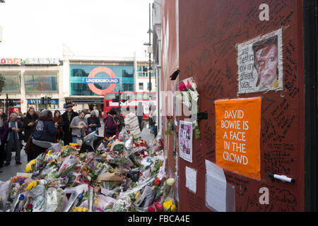 London, UK. 13th Jan, 2016.Fans pay tribute to David Bowie at a mural in Brixton where he was born.
