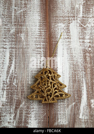 Golden Christmas Ornaments, Glitter Star Decoration on Wooden Background Stock Photo