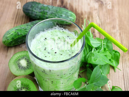 Healthy Green Detox Smoothie with Baby Spinach, Kiwi Fruits and Cucumbers Stock Photo