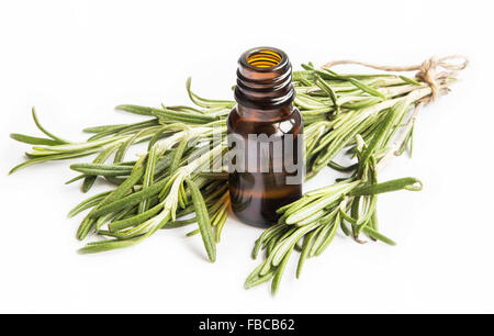 Rosemary Essential Oil Bottle with Rosemary Bunch Isolated on White Background Stock Photo