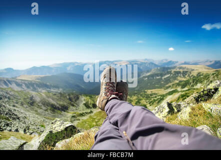 Hiking Boots, Resting on the Mountain Peak Stock Photo