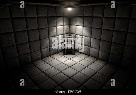 A dark dirty white padded cell in a mental hospital with an empty chair in the corner lit by a single spotlight