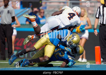 Running back Taquan Mizzell #4 of the Virginia Cavaliers scores a touchdown against the UCLA Bruins during the fourth quarter Stock Photo