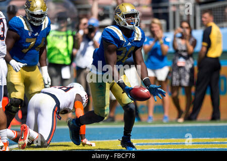 Linebacker Myles Jack #30 of the UCLA Bruins scores a touchdown against the Virginia Cavaliers during the third quarter at the Stock Photo