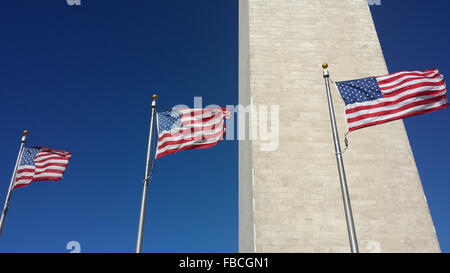 Washington Monument with flags blowing, Washington, DC USA. Stock Photo