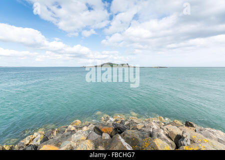 Looking across to Ireland's Eye island from the fishing port of Howth in County Dublin. Stock Photo