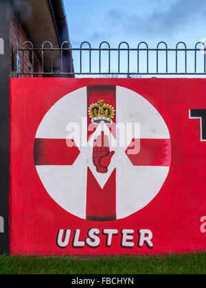 Northern Ireland flag painted on Loyalist East Belfast mural with word Ulster underneath. Stock Photo